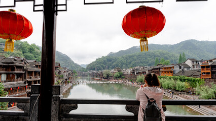 Woman observing from Snow Bridge's second floor