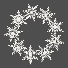 Elegant white snowflake wreath with intricate floral branches, seamless circular pattern on dark background for holiday decorations and designs