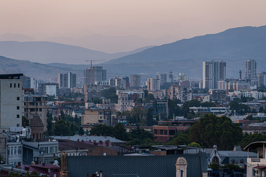 Urban view of Tbilisi's evolving architecture at dawn