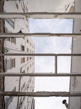 Urban building under construction with exposed beams
