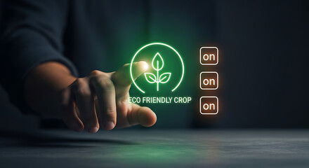 Hand touching glowing green eco friendly technology icon on dark background