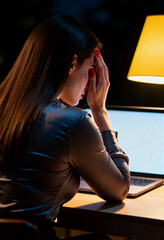 Anxious Woman Struggling with Work on Laptop Late at Night