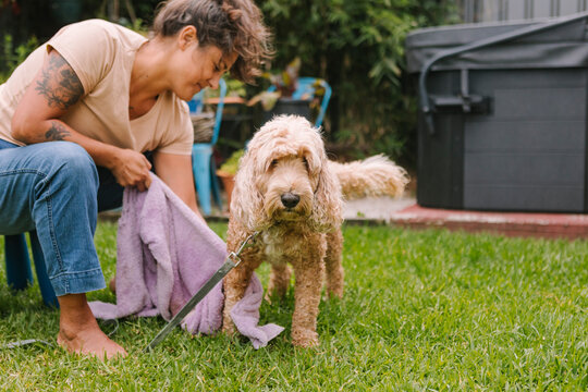 Woman enjoying outdoor time with her dog in Australia