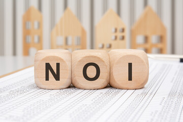Wooden blocks with KYC abbreviation on financial papers background