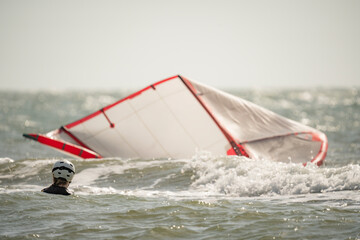 Woman kitesurfer rides waves at Salinas del Rey