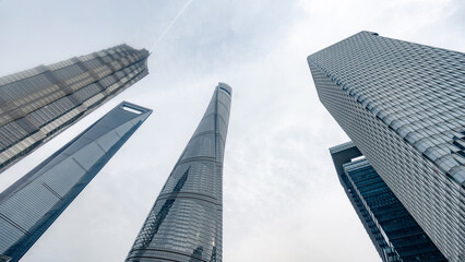 Modern skyscrapers against a cloudy Shanghai skyline