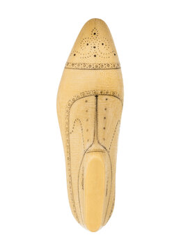 Top view of a detailed wooden shoe last on white background