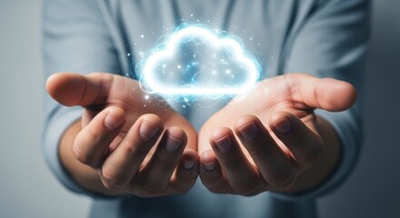 Man holding glowing cloud icon in hands. Cloud computing concept for data storage and digital technology. Global network connection.