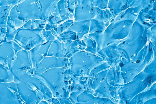 Close up of transparent gel texture with blue background