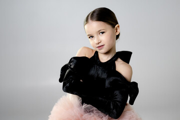 Young Girl in Black Velvet Dress with Pink Tulle Skirt