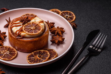 Cinnamon roll, a sweet bun with citrus, cherries, and chocolate, a Danish dessert with cream