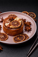 Cinnamon roll, a sweet bun with citrus, cherries, and chocolate, a Danish dessert with cream