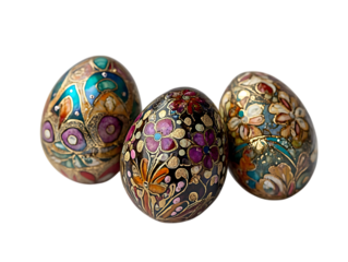 Three intricately decorated easter eggs with colorful floral patterns isolated on transparent background