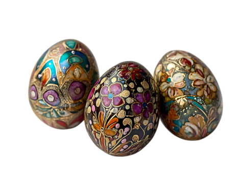 Three intricately decorated easter eggs with colorful floral patterns isolated on transparent background
