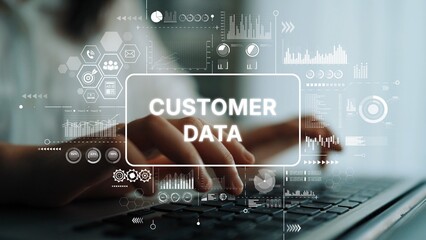 Hands Typing on Laptop with Overlay of Digital Graphics Representing Customer Data and Analytics in Modern Office Setting. Asymptotic smart data analytic.