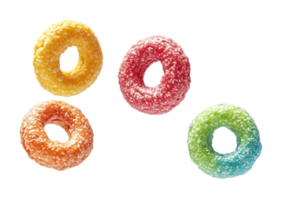 Four colorful fruit cereal loops floating in the air isolated on transparent background