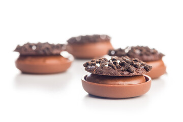 Sweet chocolate pralines. Chocolate candies isolated on white background.