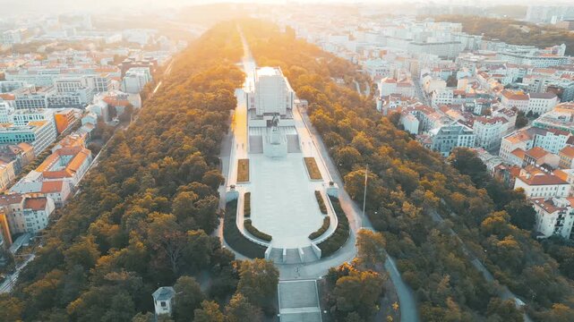 Witness the stunning sunrise over the National Monument at Vitkov in Prague. This impressive site features the equestrian statue of Jan Zizka and stunning city views. A perfect moment in Czechia.
