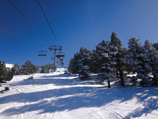 Ski Lift over Snowy Mountain Slope