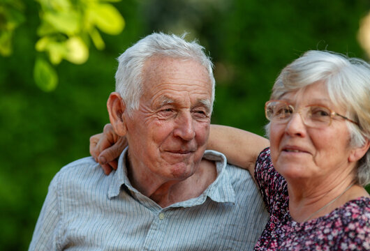 Older couple sharing moment in sunny garden