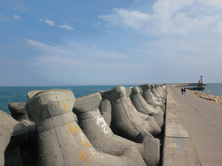 Concrete Breakwater Tetrapods on Seaside Pier