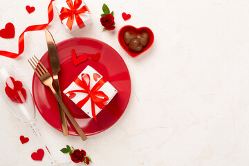 Festive table setting for Valentine's Day on concrete background, top view