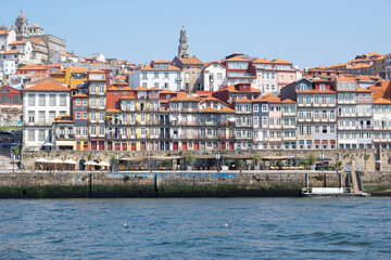 Traditional house facades decorated with Portuguese azulejo tiles in the famous Ribeira neighborhood in Porto, Portugal
