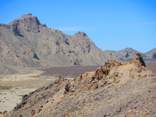 Rugged Volcanic Landscape with Rocky Mountains under Clear Blue Sky in Teide National Park, Tenerife