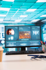 Spacious and empty healthcare space with modern medical equipment, designed for patient care and recovery. Emphasizing the importance of scan interpretations, research. Camera A.