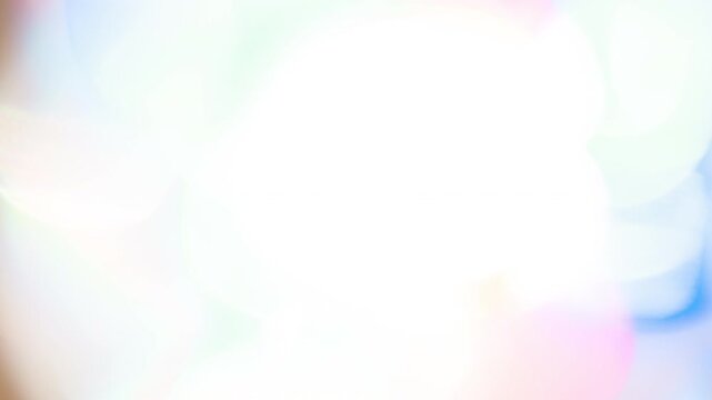 Light Colored Optical Iridescence. Loop. The light passes through the facets of a slowly rotating diamond and creates repetitive sparkling highlights and rainbow colors