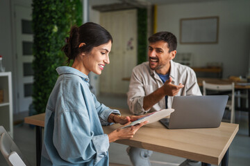 Designers collaborating on color palette for creative project