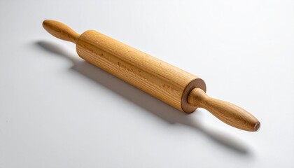 Wooden rolling pin with handles on a white surface, casting a shadow.