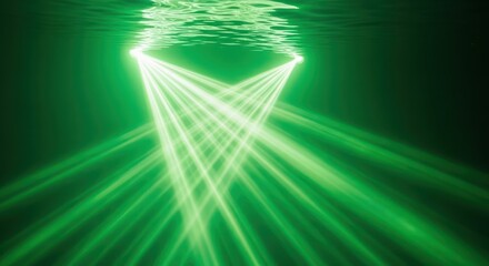 Emerald illumination with rippled reflections creates a serene underwater spectacle