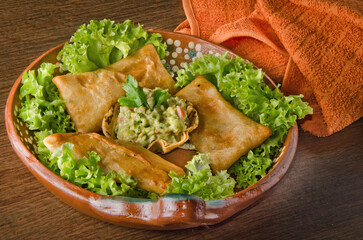 Crispy Fried Mexican Chimichangas Platter with Fresh Guacamole Dip