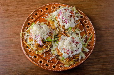 Authentic Mexican Chicken Tinga Tostadas with Cream and Fresh Cheese