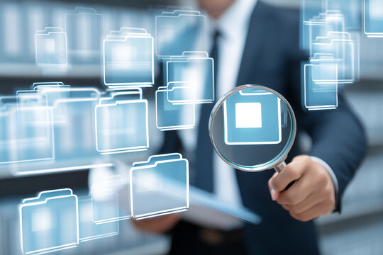 Document search reveals critical file data. Analyzing the record and information within a digital database with magnifying glass.