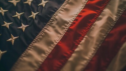 Close-up of the American flag waving in strong wind, white background, copy space concept. Close-up view of an American flag waving in the wind. The US national symbol, with a blurred effect