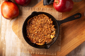 Apple oat crumble, walnuts, butter and brown sugar, homemade recipe, traditional dessert perfect for the winter season.