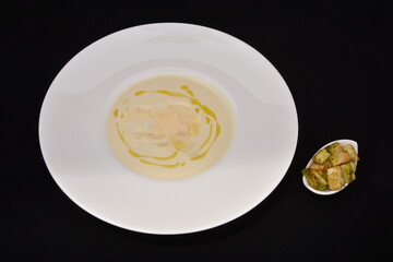 a creamy pumpkin soup, served with croutons and drizzled with olive oil. Pumpkin soup is a popular dish, often served warm, but can also be eaten cold.