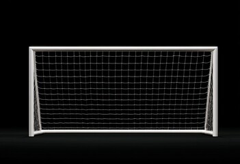 A pristine white soccer goal net silhouetted against a stark black background