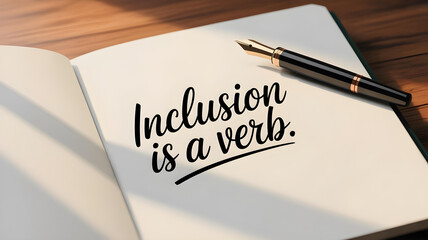 Open notebook with ink pen and handwritten inclusion is a verb quote promoting neurodiversity acceptance empathy awareness and inclusive empowerment
