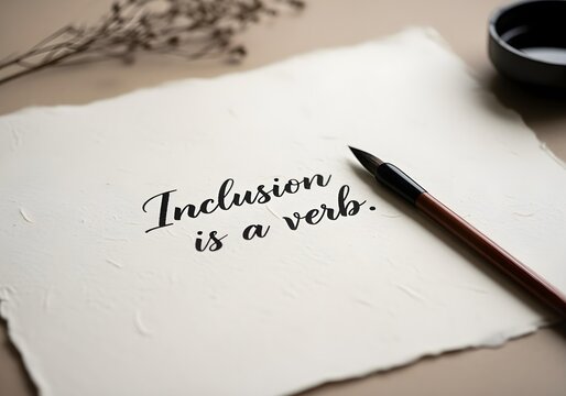 Handwritten message inclusion is a verb in elegant calligraphy with brush on paper promoting neurodiversity empowerment advocacy and inclusive awareness