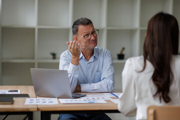 Business planning for budget, payment and research for life insurance. Transaction, accounting and man with woman, pc and mortgage for investment and taxes
