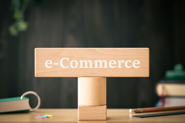 There is wood block with the word e-Commerce. It is as an eye-catching image.