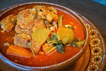 Hearty Mexican Pork and Vegetable Stew (Mole de Olla) in a Clay Bowl