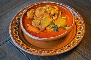 Hearty Mexican Pork and Vegetable Stew (Mole de Olla) in a Clay Bowl