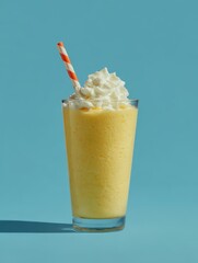 Vibrant yellow creamy smoothie with whipped cream topping refreshing cold beverage perfect for summer healthy snack fruity flavor tropical drink tasty treat