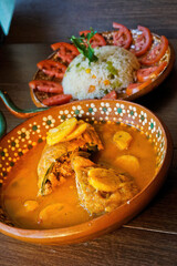 Traditional Mexican Chile Relleno in Broth Topped with Fried Plantains