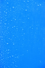 Raindrops on blue plastic