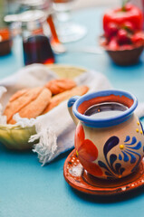 Traditional Mexican Coffee (Café de Olla) with a Basket of Sweet Bread